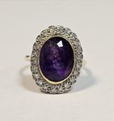 18ct yellow gold, amethyst and diamond cluster ring, the oval mixed cut collet-set amethyst
