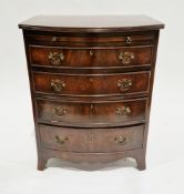 Mahogany bowfronted bachelors chest of drawers in the George III manner, having a brushing slide
