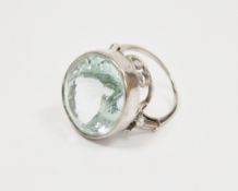 Aquamarine and white metal dress ring, the mixed cut collet set oval aquamarine approximately 2.