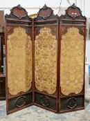 19th century mahogany three-fold dressing screen, the arched top with moulded scrolling foliate