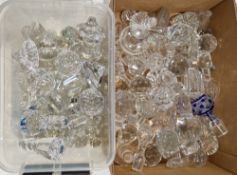 Two boxes of various decanter stoppers, including Waterford examples, most cut, with some flashed,