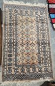 Eastern peach ground rug with geometric field, multiple geometric borders, 154cm x 97cm (some wear)