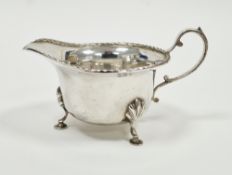 George V silver milk jug, London 1916, Horace Woodward & Co Ltd, of squat form with reeded rim,