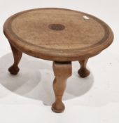 Early 20th century teak Anglo-Indian circular coffee table, the top carved with a central panel with