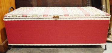 Mid-century Loom ottoman, the lid upholstered in red, yellow and grey patterned fabric, on a white