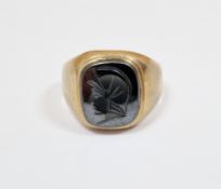 9ct yellow gold and hematite ring, the square hematite with an intaglio carving, size S 1/2,