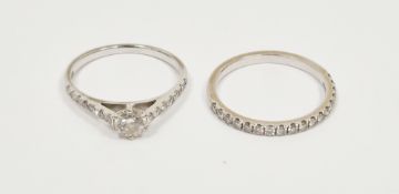 18K white gold and diamond solitaire ring having diamond shoulders, the principal stone 0.4ct,