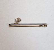 15ct yellow gold and platinum bar brooch surmounted a letter ' P ', pave set with small diamonds,