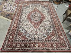 Large Belgian wool pile cream ground rug with central floral medallion on floral field, floral