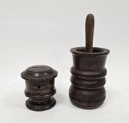Lignum Vitae mortar of turned reeded form, 17cm high and an antique sycamore pestle and a 19th