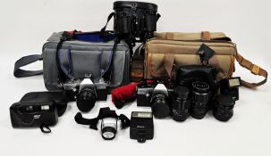 Collection of cameras and equipment including a Praktica MTL3 camera, a Praktica Super TL1000