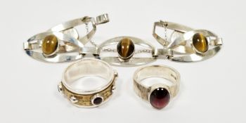 Three items of silver jewellery including five panel bracelet set with five cabochon oval tiger
