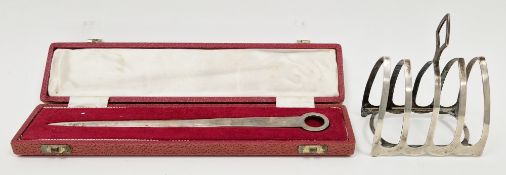 Cased silver skewer, Sheffield 1965, Francis Howard, 22cm long together with Art Deco silver toast