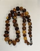 Baltic amber boulder necklace, comprising forty-two beads, largest approximately 2.5cm diameter,