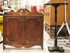 Late 19th century mahogany hanging cupboard with shaped pierced top rail, two cupboard doors opening