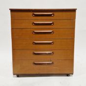 Mid-century teak chest of six drawers by Schreiber, each drawer with wooden rolled handles, on