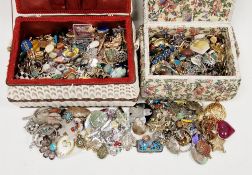 Two sewing baskets filled with a large quantity of costume jewellery including polished stone items,