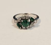 18ct white gold, emerald and diamond dress ring, the central claw-set round mixed cut emerald