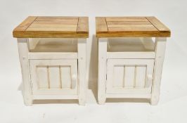 Pair of modern bedside cabinets with pale hardwood tops and white painted bases, each with a