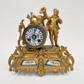 Continental gilt metal mantel clock with painted porcelain inserts, the porcelain dial with roman