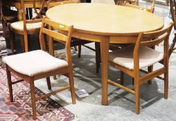 Mid-century Jentique teak dining room table and four chairs, the oval dining table extending with an