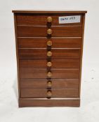 Modern John Austin Furniture mahogany-effect chest of four drawers, on a plinth base with a glass