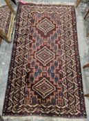 Large Eastern brown ground rug with three central lozenge medallions on geometric field, multiple