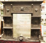 19th century oak overmantel mirror, heavily carved with lion masks and foliate scrolls, comprising a