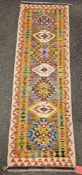 Chobi Kilim orange ground runner with seven alternating lozenges, multiple geometric borders 196cm x