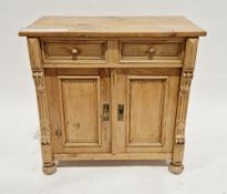 19th century continental pine side cabinet, the rectangular top over two moulded drawers with knob