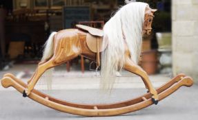 20th century Palomino compressed wood rocking horse with horsehair mane and tail and leather