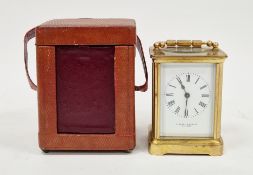 Brass cased carriage clock, the enamel dial with roman numerals, retailers mark 'Kamozzi & Baxter,