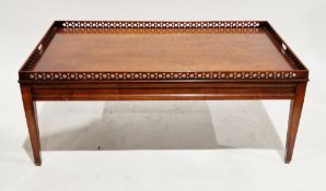 Modern coffee table in the Chippendale manner, the rectangular top with pierced gallery rail, on