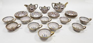 20th century Italian maiolica gold and ruby lustred part tea service, blue D.A.R within a triangle/