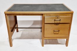 Mid-century teak desk, the rectangular top with black leather-effect vinyl over a pedestal with