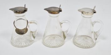 Set of three George V silver and glass whisky noggins, Birmingham 1929, Hukin & Heath Ltd, the