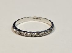 18ct white gold and diamond eternity ring of ropetwist design, illusion set with small diamonds,