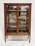 Edwardian mahogany and satinwood inlaid display cabinet, the two clear glazed doors opening to three