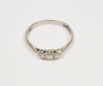 18ct gold and three-stone diamond ring set three claw set stones (the shank cut), size M 1/2,