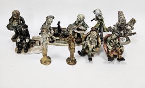 Collection of pottery figures by Norman Underhill, including two figures seated in armchairs, figure