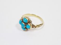 19th century yellow metal and turquoise ring,  set with a cluster of five collet set cabochon