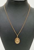 9ct yellow gold oval St Christopher pendant, 2.3cm long on a fine 9ct gold chain, approximate