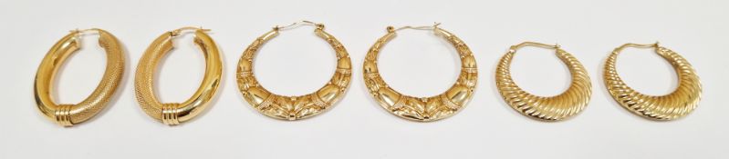 Three pairs of 9ct yellow gold hoop earrings, one pair with embossed floral decoration, another pair