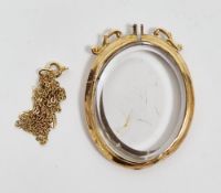 9ct gold and glass double-sided oval locket with scroll surmount, screw fixing missing and a