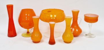 Group of mid-century Empoli and similar glass vessels, including a baluster two-handled flared