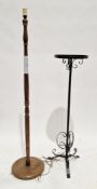 Oak turned standard lamp on circular base, 149cm high, a wrought iron jardiniere stand, 111cm high
