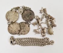 Sterling silver charm bracelet holding a silver charm and white metal charms together with a