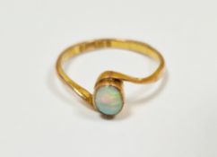 9ct yellow gold opal cross-over ring, the single oval cabochon opal in a rub over setting, size N,