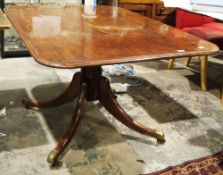 Early 19th century mahogany breakfast table, the rectangular tilt-top with rounded corners and