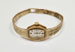 Lady's Accurist 9ct gold 21 jewel wristwatch, the silvered dial with raised baton hour markers,